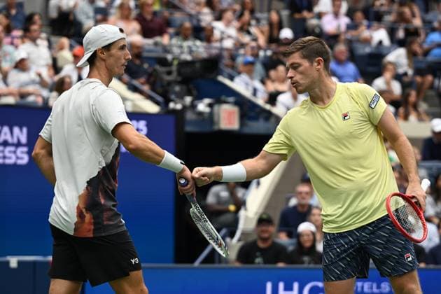 (250907) -- NEW YORK, Sept. 7, 2025 -- Joe Salisbury (L) Neal Skupski celebrate scoring during the men s doubles final match between Marcel Granollers of Spain Horacio Zeballos of Argentina and Joe Salisbury Neal Skupski of Britain at the 2025 US Open tennis championships in New York, the United States, Sept. 6, 2025. ) (SP)U.S.-NEW YORK-TENNIS-US OPEN-MEN S DOUBLES-FINAL LixRui 