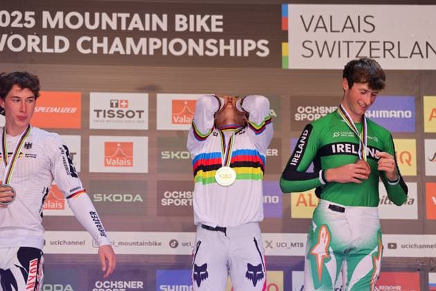 2025 UCI Mountain Bike World Championships Picture by Alex Whitehead SWpix.com - 07 09 2025 - Cycling - 2025 UCI Mountain Bike World Championships - Downhill - ChampÃ ry, Valais, Switzerland - Men Elite Podium - Jackson Goldstone (Canada) receiving the Gold Medal to become World Champion with Henri Kiefer (Germany) receiving the Silver Medal and Ronan Dunne (Ireland) receiving the Bronze Medal Copyright: x xSWpix.comx(t axPhotographyxHubxLtd)xAlexxWhitehead SWpix.comx SWP-3030-2819