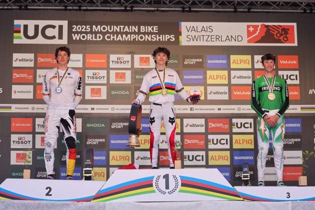 2025 UCI Mountain Bike World Championships Picture by Alex Whitehead SWpix.com - 07 09 2025 - Cycling - 2025 UCI Mountain Bike World Championships - Downhill - ChampÃ ry, Valais, Switzerland - Men Elite Podium - Jackson Goldstone (Canada) receiving the Gold Medal to become World Champion with Henri Kiefer (Germany) receiving the Silver Medal and Ronan Dunne (Ireland) receiving the Bronze Medal Copyright: x xSWpix.comx(t axPhotographyxHubxLtd)xAlexxWhitehead SWpix.comx SWP-3030-2820