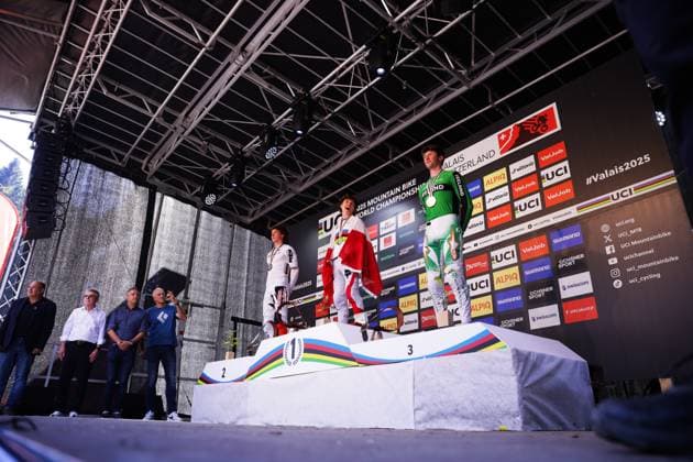 2025 UCI Mountain Bike World Championships Picture by Ed Sykes SWpix.com - 07 09 2025 - Cycling - 2025 UCI Mountain Bike World Championships - Downhill - ChampÃ ry, Valais, Switzerland - Men Elite Podium - Jackson Goldstone (Canada) receiving the Gold Medal to become World Champion with Henri Kiefer (Germany) receiving the Silver Medal and Ronan Dunne (Ireland) receiving the Bronze Medal Copyright: x xSWpix.comx(t axPhotographyxHubxLtd)xEdxSykes SWpix.comx SWP-3030-2828