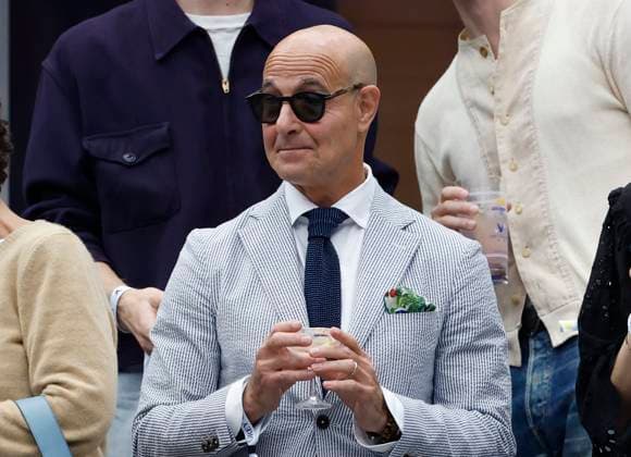 Stanley Tucci sits in the stands to watch Jannik Sinner of Italy play Carlos Alcaraz of Spain in the Men s Finals of the 2025 US Open Tennis Championship in Arthur Ashe Stadium at the USTA Billie Jean King National Tennis Center in Flushing Meadows, New York, on Sunday, September 7, 2025.  NYP20250907113 COREYxSIPKIN