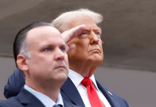 President Donald Trump salutes during the playing of the National Anthem before Jannik Sinner of Italy plays Carlos Alcaraz of Spain in the Men s Finals of the 2025 US Open Tennis Championship in Arthur Ashe Stadium at the USTA Billie Jean King National Tennis Center in Flushing Meadows, New York, on Sunday, September 7, 2025.  NYP20250907116 COREYxSIPKIN