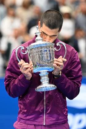 (250908) -- NEW YORK, Sept. 8, 2025 -- Carlos Alcaraz of Spain kisses his trophy after winning the men s singles final match between Carlos Alcaraz of Spain and Jannik Sinner of Italy at the 2025 US Open tennis championships in New York, the United States, Sept. 7, 2025. ) (SP)U.S.-NEW YORK-TENNIS-US OPEN-MEN S SINGLES-FINAL LixRui 