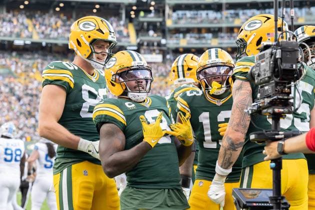 September 7, 2025: Green Bay Packers running back Josh Jacobs (8) smiles at the camera after he scores a touchdown while Green Bay Packers tight end John FitzPatrick (86) and Green Bay Packers wide receiver Dontayvion Wicks (13) look on during a game against the Detroit Lions in Green Bay, WI. Cal Media. Green Bay United States of America - ZUMAc04_ 20250907_zma_c04_245 Copyright: xKirstenxSchmittx