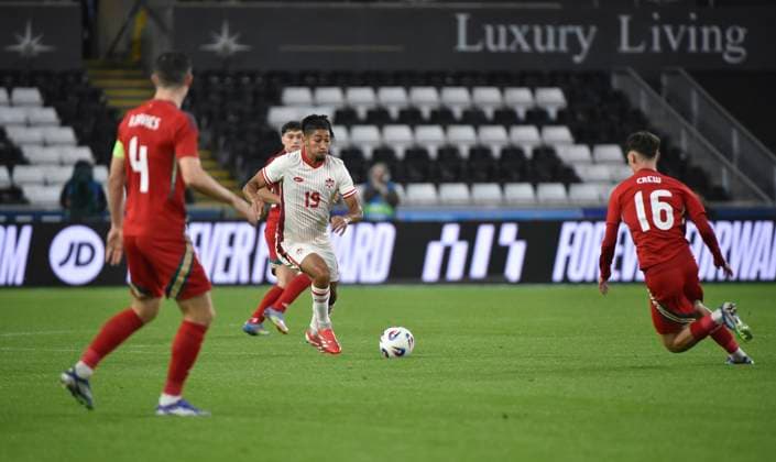 9th September 2025; Swansea.com Stadium, Swansea, Wales; Friendly International Football, Wales versus Canada; Nathan-Dylan Saliba of Canada being pressured by Charlie Crew and Ben Davies of Wales  AledxHopkins