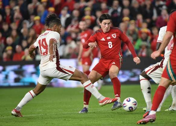 9th September 2025; Swansea.com Stadium, Swansea, Wales; Friendly International Football, Wales versus Canada; Nathan-Dylan Saliba of Canada tackles Harry Wilson of Wales  AledxHopkins