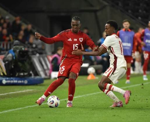 9th September 2025; Swansea.com Stadium, Swansea, Wales; Friendly International Football, Wales versus Canada; Ronan Kpakio of Wales is tackled by Ali Ahmed of Canada  AledxHopkins