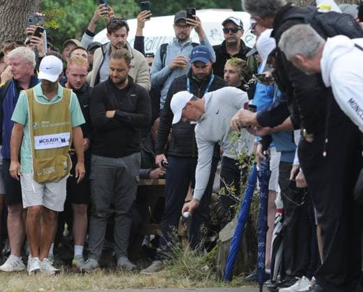 Golf - 2025 DP World Tour - BMW PGA, Golf Herren Championship - Round Two - Wentworth Club - Friday 12th September 2025 Rory McIlroy of Ireland drops his ball after diving into the trees 