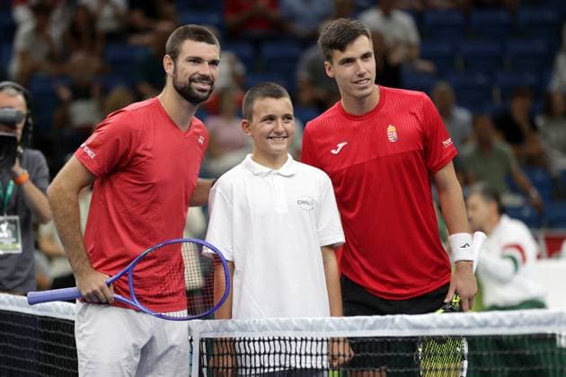 TENNIS - Davis Cup, HUN vs AUT DEBRECEN,HUNGARY,12.SEP.25 - TENNIS - ITF Davis Cup, qualification round 2, Hungary vs Austria. Image shows Jurij Rodionov (AUT) a kid and Fabian Marozsan (HUN).  GEPAxpictures xWalterxLuger