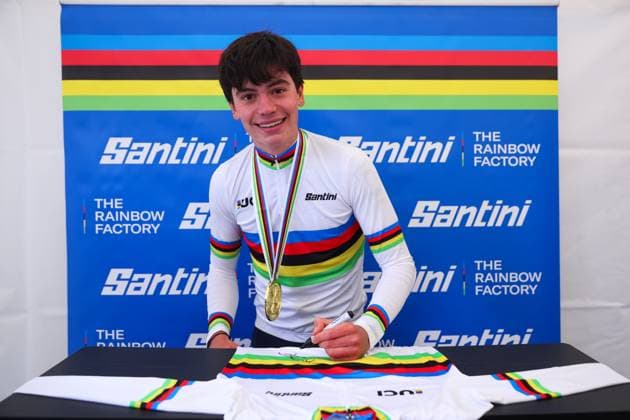 2025 UCI Mountain Bike World Championships Picture by Ed Sykes SWpix.com - 12 09 2025 - Cycling - 2025 UCI Mountain Bike World Championships - Cross-country Olympic - Crans Montana, Valais, Switzerland - Men Junior Podium - Lucas Teste (France) signing the Santini Rainbow Jersey Copyright: x xSWpix.comx(t axPhotographyxHubxLtd)xEdxSykes SWpix.comx SWP-3030-3725