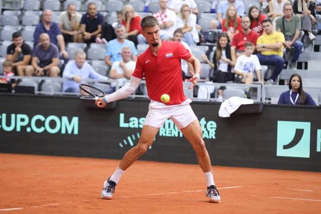Croatia v France - 2025 Davis Cup Qualifiers Second Round: Day 1 Dino Prizmic of Croatia plays a forehand in his tie against Corentin Moutet of France during the 2025 Davis Cup Qualifier second round match between Croatia and France at Dvorana Gradski Vrt on September 12, 2025 in Osijek, Croatia.  DavidxJerkovic PIXSELL
