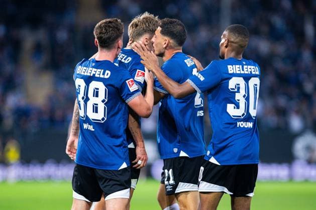 12 09 2025 Soccer, 2025 2026, 2 Bundesliga, Matchday 5, DSC Arminia Bielefeld 1 FC Magdeburg M Joel Grodowski Bielefeld celebrates after his goal to 2 0 with L R Marius Wörl Bielefeld , Stefano Russo Bielefeld , Isaiah Young Bielefeld DFL REGULATIONS PROHIBIT ANY USE OF PHOTOGRAPHS AS IMAGE SEQUENCES AND OR QUASI VIDEO