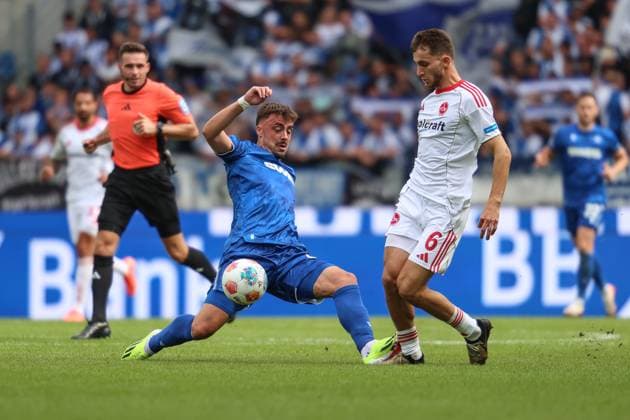 Philipp Foerster Karlsruher SC, 11 in duel with Adam Markhiev 1 FC Nuernberg, 06 , GER, Karlsruher SC vs 1 FC Nuernberg, 2 Bundesliga, Matchday 5, 2025 2026, 13 09 2025, DFL REGULATIONS PROHIBIT ANY USE OF PHOTOGRAPHS AS IMAGE SEQUENCES AND OR QUASI VIDEO, GER, Karlsruher SC vs 1 FC Nuernberg, 2 Bundesliga, Matchday 5, 2025 2026, 13 09 2025 Karlsruhe Copyright: xEibner-Pressefoto JanxPrihodax EP_JPA