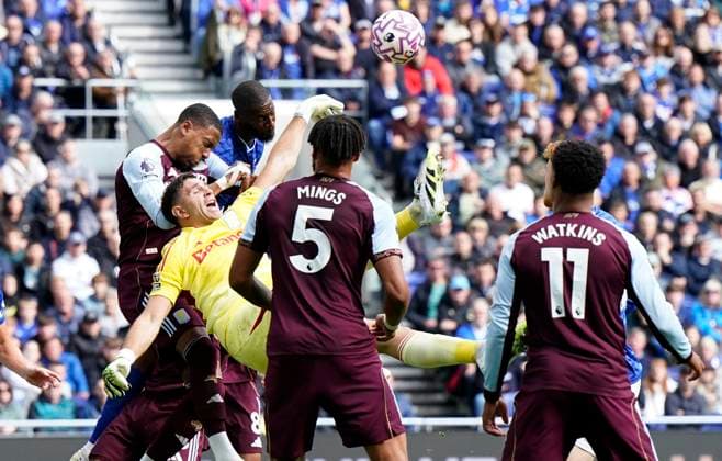 Liverpool, England, 13th September 2025. Emiliano Martinez of Aston Villa (C) falls under pressure from Dominic Calvert Lewin of Everton and Ezri Konsa of Aston Villa during the Everton vs Aston Villa Premier League match at Hill Dickinson Stadium, Liverpool. Picture credit should read: Andrew Yates Sportimage EDITORIAL USE ONLY. No use with unauthorised audio, video, data, fixture lists, club league logos or live services. Online in-match use limited to 120 images, no video emulation. No use in betting, games or single club league player publications. SPI_012_AY_EVERTON_VILLA SPI-4134-0011