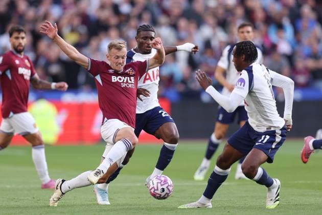 London, England, 13th September 2025. James Ward-Prowse of West Ham is challenged by Mohammed Kudus (c) and Mathys Tel of Tottenham Hotspur during the West Ham United vs Tottenham Hotspur Premier League match at the London Stadium, London. Picture credit should read: Paul Terry Sportimage EDITORIAL USE ONLY. No use with unauthorised audio, video, data, fixture lists, club league logos or live services. Online in-match use limited to 120 images, no video emulation. No use in betting, games or single club league player publications. SPI_012_PT_West_Ham_Tottenham SPI-4133-0012