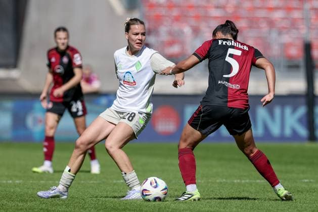 from left Juliane Wirtz SV Werder Bremen, 28 and Clara Fröhlich 1 FC Nürnberg, 5 in a duel, dynamic, action, action, game scene, THE DFB GUIDELINES PROHIBIT ANY USE OF PHOTOGRAPHS AS IMAGE SEQUENCES AND OR QUASI VIDEO DFB REGULATIONS PROHIBIT ANY USE OF PHOTOGRAPHS AS IMAGE SEQUENCES AND OR QUASI VIDEO , 13 09 2025, Nuremberg Germany , Football, Google Pixel Women Bundesliga, 1 FC Nürnberg SV Werder Bremen xobx
