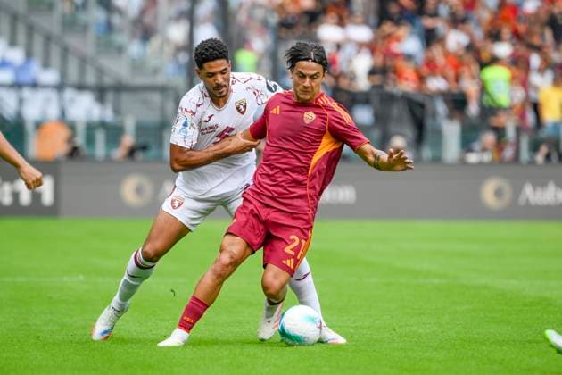 Roma™s Paulo Dybala and Torino s Saul Coco during the Serie A Enilive soccer match between AS Roma and Torino FC at the Rome s Olympic stadium, Italy - Sunday, September 14, 2025. - Soccer.  Copyright: xFabrizioxCorradetti LaPressex