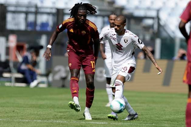 Italy: Serie a football match AS Roma vs Torino Roma™s French midfielder Manu Kone challenges for the ball with Torino s Belgian forward Cyril Ngonge during the Serie A football match between AS Roma vs Torino at the Olimpico Stadium in Rome, Italy on September 14, 2025. _BPH8684 Copyright: xAntonioxBalascox