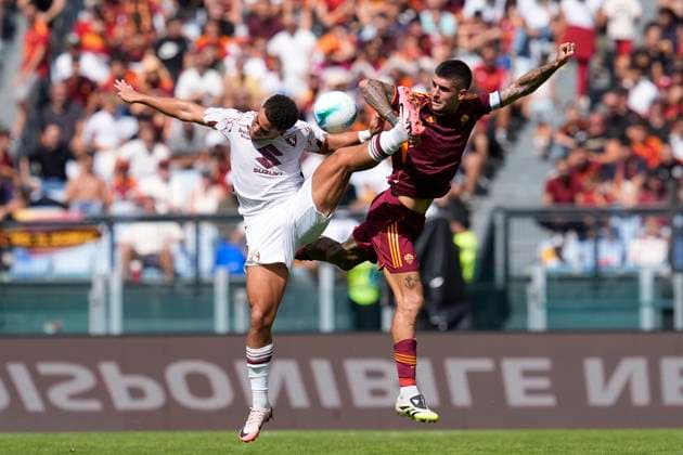 Tino Anjorin (Torino FC) and Gianluca Mancini (AS Roma) battle for the ball, Serie A, AS Roma v Torino FC, Olimpico Stadium, September 14, 2025, Rome, Italy.