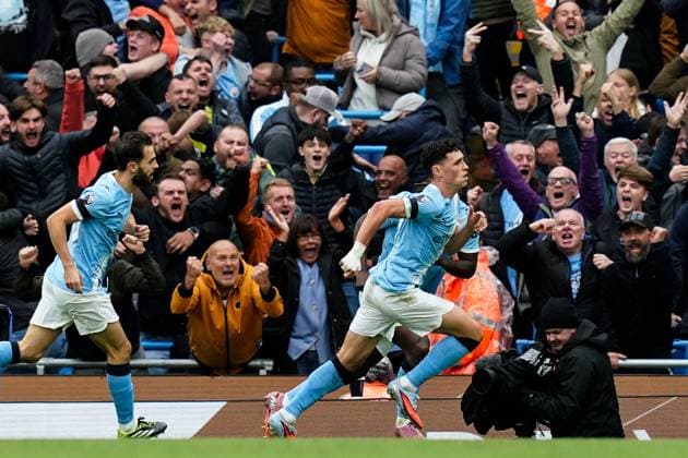 Manchester, England, 14th September 2025. Phil Foden of Manchester City celebrates his goal to make it 1-0 during the Manchester City vs Manchester United, ManU Premier League match at the Etihad Stadium, Manchester. Picture credit should read: Andrew Yates Sportimage EDITORIAL USE ONLY. No use with unauthorised audio, video, data, fixture lists, club league logos or live services. Online in-match use limited to 120 images, no video emulation. No use in betting, games or single club league player publications. SPI_023_AY_MCI_MUFC SPI-4139-0023