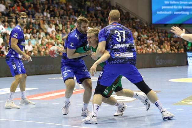 14 09 2025, xtgx, SC Magdeburg TVB Stuttgart v l Samuel Roethlisberger Röthlisberger, Stuttgart, 17 , Gisli Thorgeir Kristjansson Magdeburg, 10 , Jonas Truchanovicius Stuttgart, 37 Magdeburg