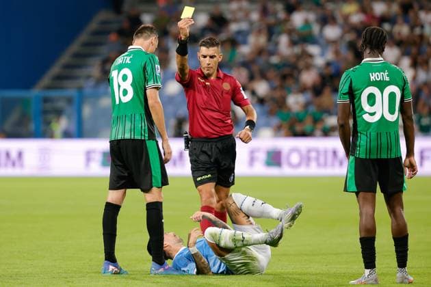 14th September 2025; Mapei Stadium, Reggio Emilia, Italy, Serie A Football, Sassuolo versus Lazio; referee Paride Tremolada issues a yellow card to Nemanja Matic of US Sassuolo Calcio  EmanuelexPennacchio