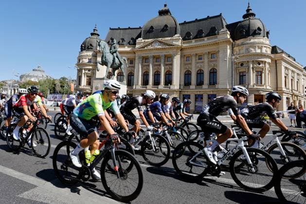 (250915) -- ROMANIA, Sept. 15, 2025 -- Cyclists pass the National Central University Library during the last stage of Tour of Romania 2025 cycling race in Bucharest, Romania, Sept. 14, 2025. (Photo by Xinhua) (SP)ROMANIA-BUCHAREST-CYCLING TOUR OF ROMANIA CristianxCristel 