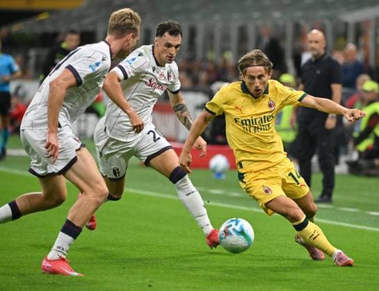 (250915) -- MILAN, Sept. 15, 2025 -- AC Milan s Luka Modric (R) vies with Bologna s Torbjorn Heggem (L) and Nadir Zortea during a Serie A football match between AC Milan and Bologna in Milan, Italy, Sept. 14, 2025. (Photo by Xinhua) (SP)ITALY-MILAN-FOOTBALL-SERIE A-AC MILAN VS BOLOGNA AlbertoxLingria 