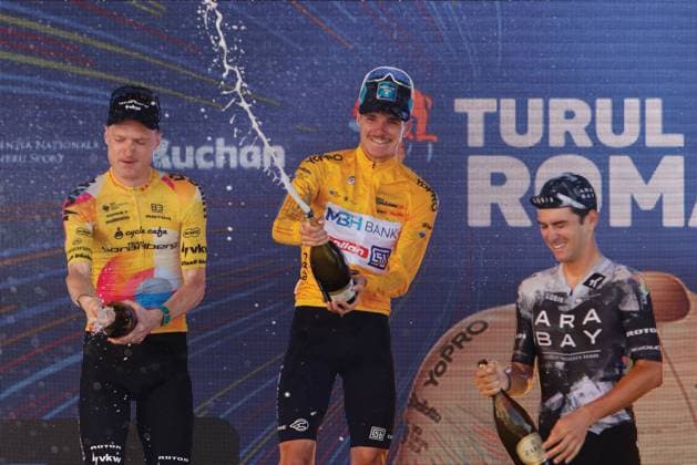 (250915) -- ROMANIA, Sept. 15, 2025 -- Yellow jersey Cesare Chesini (C) of Italy celebrates on the podium after the last stage of Tour of Romania 2025 cycling race in Bucharest, Romania, Sept. 14, 2025. (Photo by Xinhua) (SP)ROMANIA-BUCHAREST-CYCLING TOUR OF ROMANIA CristianxCristel 