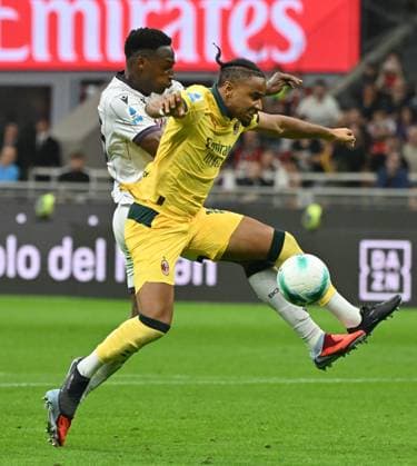 (250915) -- MILAN, Sept. 15, 2025 -- AC Milan s Christopher Nkunku (R) vies with Bologna s Jhon Lucumi during a Serie A football match between AC Milan and Bologna in Milan, Italy, Sept. 14, 2025. (Photo by Xinhua) (SP)ITALY-MILAN-FOOTBALL-SERIE A-AC MILAN VS BOLOGNA AlbertoxLingria 