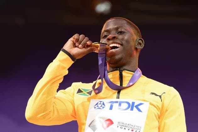 Athletics: World championships in Tokyo Gold medalist Oblique Seville of Jamaica celebrates on the podium during the medal ceremony for the men s 100-meter event at the World Athletics Championships at the National Stadium in Tokyo on Sept. 15, 2025.  A14AA0004851379P