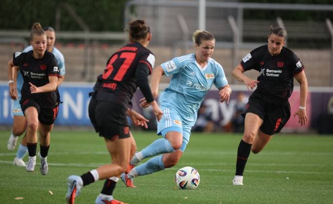 Dina Orschmann FCU on the ball against Katharina Piljic B04, R and Carlotta Wamser B04 , Leverkusen, Germany 15 09 2025, Womens Bundesliga, Matchday 2, Bayer 04 Leverkusen 1 FC Union Berlin