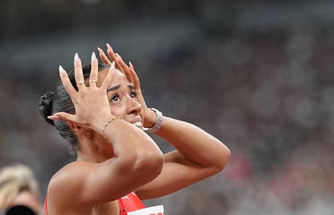 (250916) -- TOKYO, Sept. 16, 2025 -- Gold medalist Ditaji Kambundji of Switzerland reacts after the women s 100m hurdles final at the 2025 World Athletics Championships in Tokyo, Japan, Sept. 15, 2025. ) (SP)JAPAN-TOKYO-ATHLETICS-WORLD ATHLETICS CHAMPIONSHIPS-WOMEN S 100M HURDLES-FINAL JuxHuanzong 