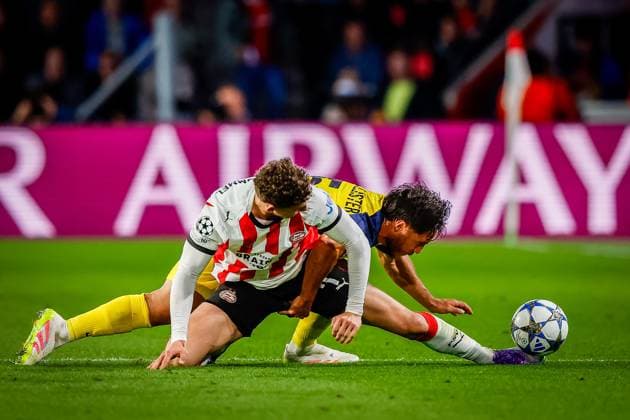 EINDHOVEN , 16-09-2025 , Philips Stadium , season 2025 2026 , UEFA Champions League football , league phase, match between PSV and Union SG , picture shows Union SG player Kevin Mac Allister and PSV player Ruben van Bommel PSV - Union SG  x31053779x Copyright: