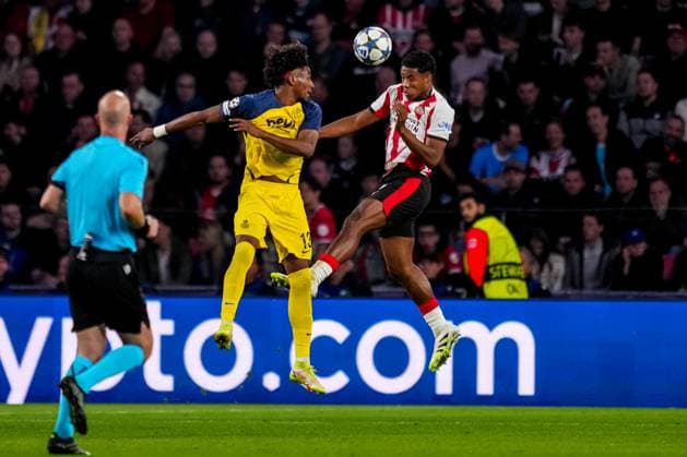 EINDHOVEN, NETHERLANDS - SEPTEMBER 16: Kevin Rodriguez of R. Union Saint Gilloise and Ryan Flamingo of PSV compete for the headed ball during the UEFA Champions League 2025 26 League Phase MD1 match between PSV Eindhoven and R. Union Saint-Gilloise at PSV Stadion on September 16, 2025 in Eindhoven, Netherlands. (Photo by Rene Nijhuis) SPO  Copyright: xRenexNijhuis
