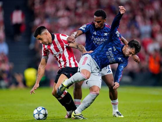 Alex Berenguer of Athletic Bilbao in action against Martin Zubimendi (right) and Gabriel of Arsenal Athletic Bilbao v Arsenal, UEFA Champions League, Group Stage, Football, Estadio de San Mames, Bilbao, Spain - 16 Sep 2025Bilbao Estadio de San Mames Spain EDITORIAL USE ONLY No use with unauthorised audio, video, data, fixture lists, club league logos or live services. Online in-match use limited to 120 images, no video emulation. No use in betting, games or single club league player publications. Copyright: xSergioxRuiz Shutterstockx 15481341dj