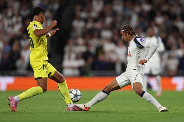 London, England, 16th September 2025. Santiago Mourino of Villarreal is fouled by Xavi Simons of Tottenham Hotspur who then receives a yellow card during the Tottenham Hotspur vs Villarreal UEFA Champions League match at the Tottenham Hotspur Stadium, London. Picture credit should read: Paul Terry Sportimage EDITORIAL USE ONLY. No use with unauthorised audio, video, data, fixture lists, club league logos or live services. Online in-match use limited to 120 images, no video emulation. No use in betting, games or single club league player publications. SPI_021_PT_Tottenham_Villarreal SPI-4141-0021