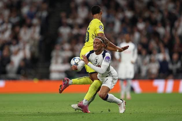 London, England, 16th September 2025. Santiago Mourino of Villarreal is fouled by Xavi Simons of Tottenham Hotspur who then receives a yellow card during the Tottenham Hotspur vs Villarreal UEFA Champions League match at the Tottenham Hotspur Stadium, London. Picture credit should read: Paul Terry Sportimage EDITORIAL USE ONLY. No use with unauthorised audio, video, data, fixture lists, club league logos or live services. Online in-match use limited to 120 images, no video emulation. No use in betting, games or single club league player publications. SPI_022_PT_Tottenham_Villarreal SPI-4141-0022