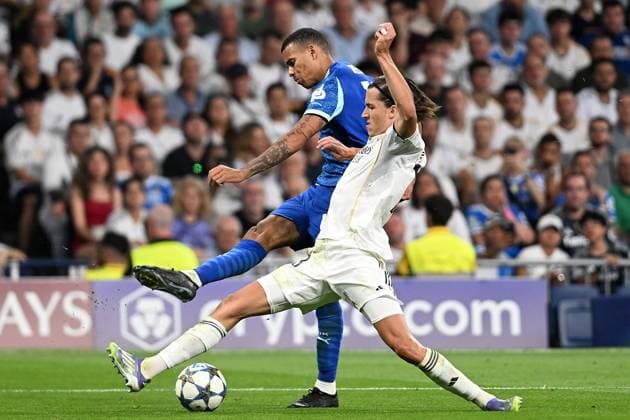 Real Madrid CF s Alvaro Carreras (r) and Olympique de Marseille s Mason Greenwood during Champions League 2024 2025 Round 1 match. September 16,2025. (2025091587)