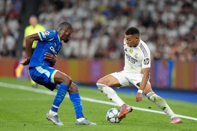 September 16, 2025, Madrid, Spain: Kylian MbappÃ of Real Madrid CF and Geoffrey Kondogbia of Olympique de Marseille are seen during the UEFA Champions League match between Real Madrid CF and Olympique de Marseille at the Santiago BernabÃ u. Final Score; Real Madrid 2 - 1 Olympique de Marseille Madrid Spain - ZUMAs197 20250916_aaa_s197_331 Copyright: xGokhanxTanerx