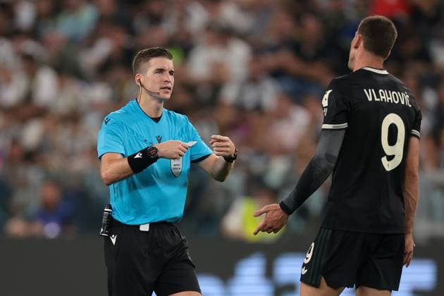 Turin, Italy, 16th September 2025. The Referee Francois Letexier of France reacts with Dusan Vlahovic of Juventus during the Juventus vs Borussia Dortmund UEFA Champions League match at Allianz Stadium, Turin. Picture credit should read: Jonathan Moscrop Sportimage EDITORIAL USE ONLY. No use with unauthorised audio, video, data, fixture lists, club league logos or live services. Online in-match use limited to 120 images, no video emulation. No use in betting, games or single club league player publications. SPI_155_JM_JUVE_BORUSSIA_ SPI-4122-0155