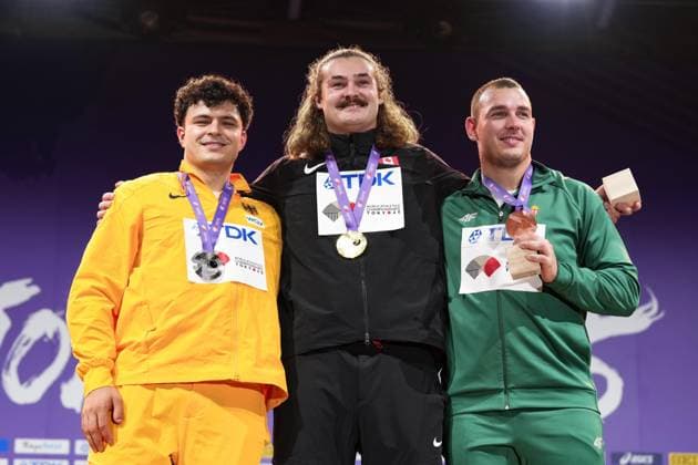 World Athletics Championships Tokyo 2025 Gold medalist Ethan Katzberg (C) of Canada poses during the medal ceremony for the men s hammer throw event at the World Athletics Championships at National Stadium in Tokyo on Sept. 17, 2025, alongside silver medalist Merlin Hummel (L) of Germany and bronze medalist Bence Halasz of Hungary.  A14AA0004856107P