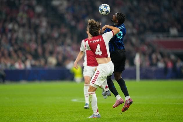 AMSTERDAM, 23-08-2025, Johan Cruijff ArenA ,season 2025 2026 , UEFA Champions League football , league phase, .Match between Ajax and Inter Milan , Picture shows Ajax player Ko Itakura, Inter player Marcus Thuram Ajax - Inter  x31066296x Copyright:
