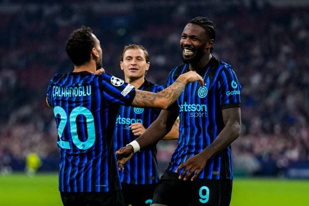 AMSTERDAM, NETHERLANDS - SEPTEMBER 17: Marcus Thuram of FC Internazionale celebrates with Hakan Calhanoglu of FC Internazionale after scoring his team s second goal during the UEFA Champions League 2025 26 League Phase MD1 match between AFC Ajax and FC Internazionale Milano at Johan Cruijff Arena on September 17, 2025 in Amsterdam, Netherlands. (Photo by Rene Nijhuis) SPO  Copyright: xRenexNijhuis