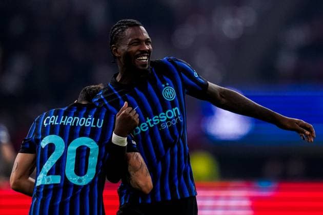 AMSTERDAM, NETHERLANDS - SEPTEMBER 17: Marcus Thuram of FC Internazionale celebrates with Hakan Calhanoglu of FC Internazionale after scoring his team s second goal during the UEFA Champions League 2025 26 League Phase MD1 match between AFC Ajax and FC Internazionale Milano at Johan Cruijff Arena on September 17, 2025 in Amsterdam, Netherlands. (Photo by Rene Nijhuis) SPO  Copyright: xRenexNijhuis