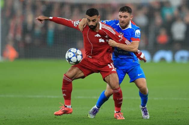17th September 2025; Anfield, Liverpool, Merseyside, England; UEFA Champions League Football, Liverpool versus Atletico Madrid; Mohammed Salah of Liverpool holds off a challenge from Javi Galan of Atletico Madrid  DavidxBlunsden
