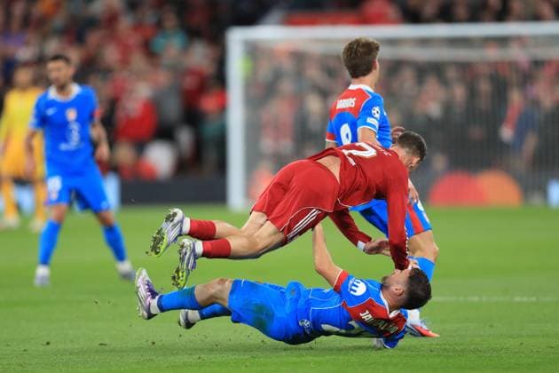 17th September 2025; Anfield, Liverpool, Merseyside, England; UEFA Champions League Football, Liverpool versus Atletico Madrid; Florian Wirtz of Liverpool collides with Javi Galan of Atletico Madrid  DavidxBlunsden
