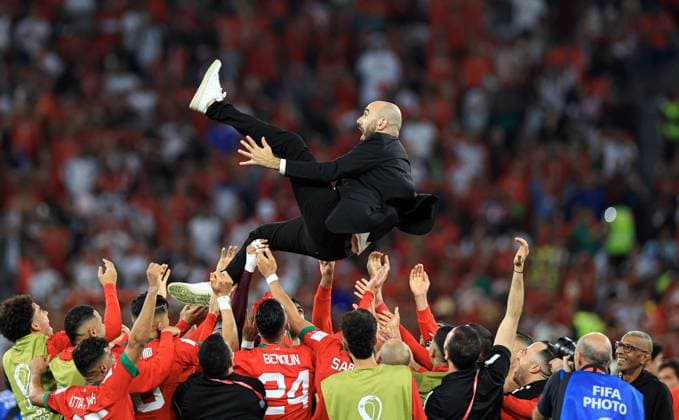 Morocco v Spain: Round of 16 - FIFA World Cup, WM, Weltmeisterschaft, Fussball Qatar 2022 AL RAYYAN, QATAR - DECEMBER 06: Morocco s head coach Walid Regragui is thrown into the air as Morocco players celebrate victory after penalty shoot-out the Qatar 2022 World Cup round of 16 football match between Morocco and Spain at the Education City Stadium in Al-Rayyan, west of Doha on December 6, 2022. Qatar World. Editorial use only. Please get in touch for any other usage.  Copyright: x2025xAnadoluxSalihxZekixFazlÄ±oÄülux