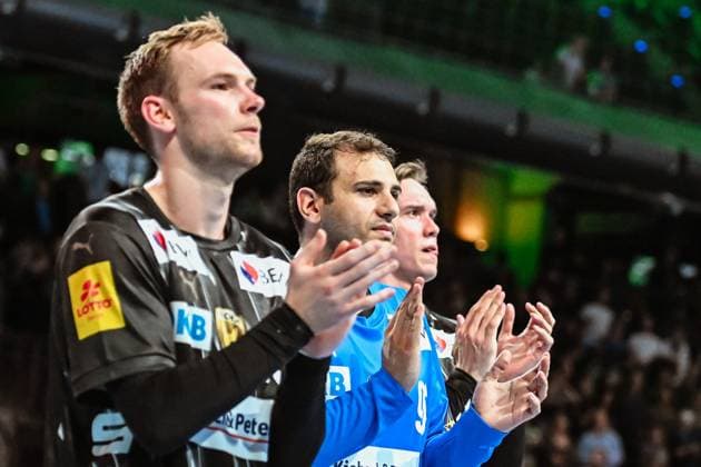 18 09 2025, xlakx, Handball, EHF Champions League, Fuechse Berlin Aalborg Handbold f l Mathias Gidsel Fuechse Berlin , Dejan Milosavljev Fuechse Berlin , Lasse Andersson Fuechse Berlin Celebrating the victory, cheering after the match Berlin Daniel Lakomski
