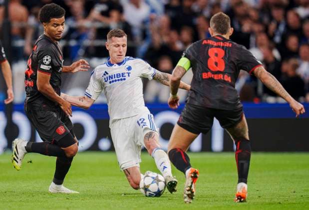 Champions League FC Copenhagen Bayer 04 Leverkusen FCKs Lukas Lerager between Bayer Leverkusens Robert Andrich and Malik Tillman during the UEFA Champions League match between FC Copenhagen and Bayer 04 Leverkusen at Parken in Copenhagen on Thursday, September 18, 2025 Photo Liselotte Sabroe Ritzau Scanpix , Copenhagen Denmark  Copyright: Ritzau Scanpix LiselottexSabroex spdk20250918-213958-L